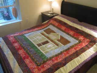 Regina in a Sears Kit House's quilt on her bed